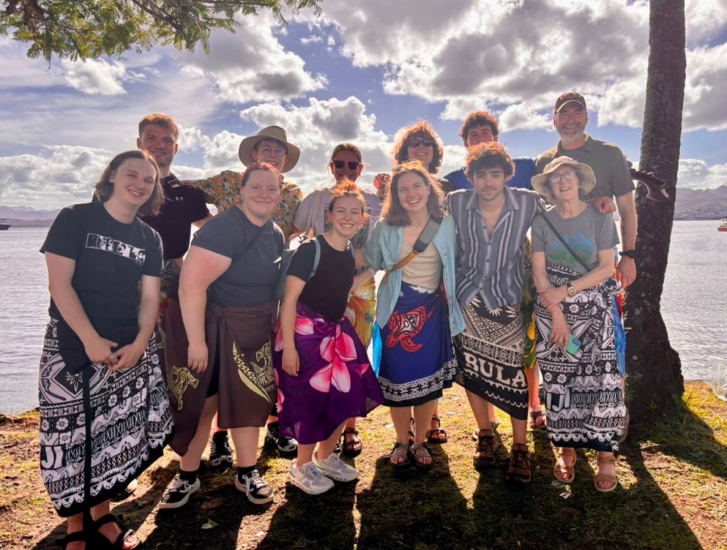 Group of people standing by beach
